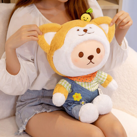 Akita dog plush toy in plaid overalls lying down with cute teddy features