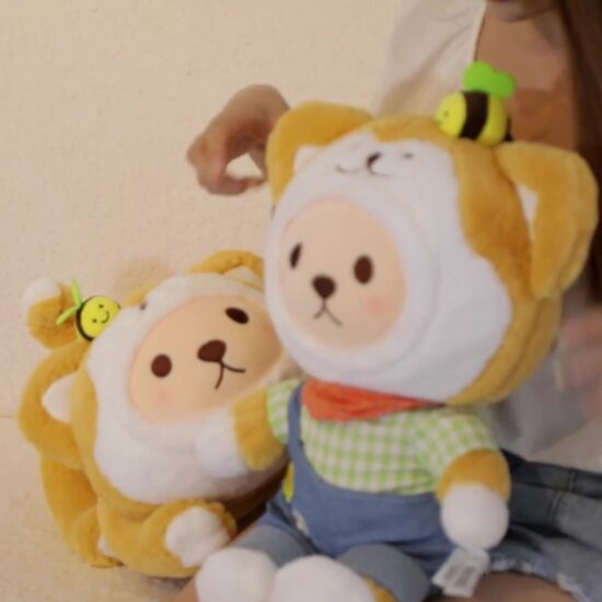 Akita dog plush toy in plaid overalls lying down with cute teddy features