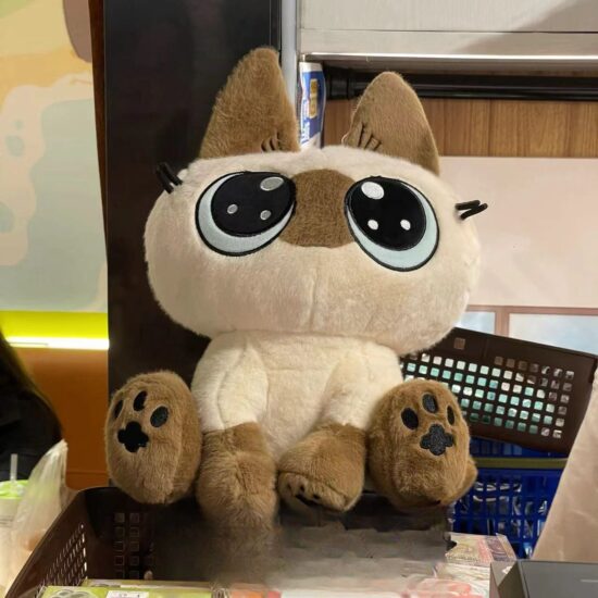 Siamese cat plush doll sitting cutely, anime-style kitten toy