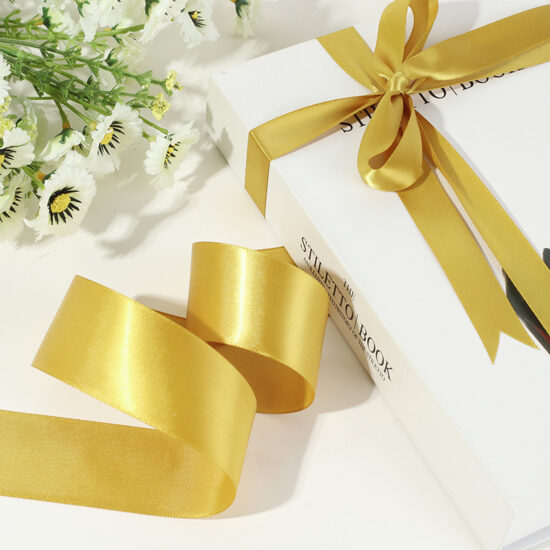 Gold satin ribbon for DIY crafts, gift wrapping, floral bouquets, and hair bows