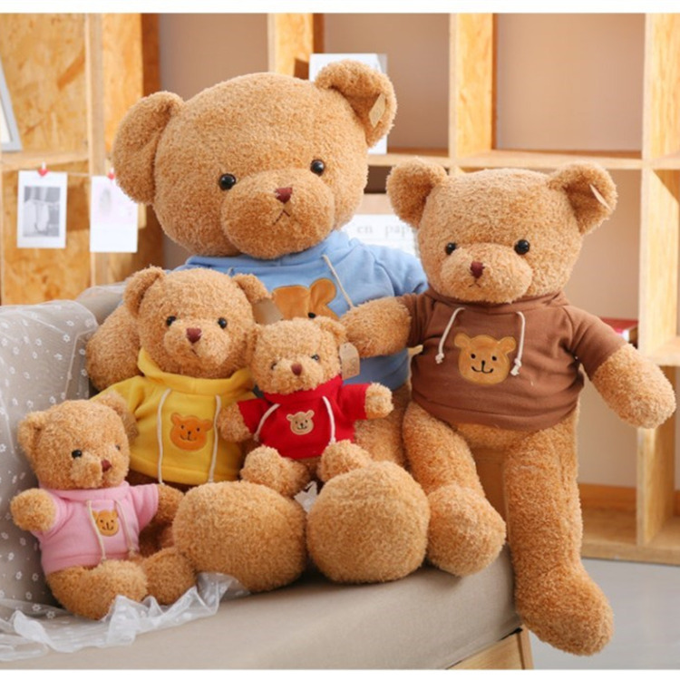 Large teddy bear plush toy wearing a knitted sweater, ideal birthday gift for girls