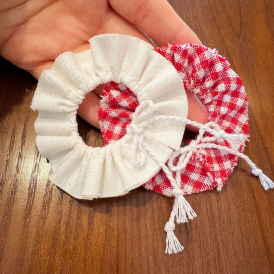 10cm plush doll wearing vintage apron and collar outfit